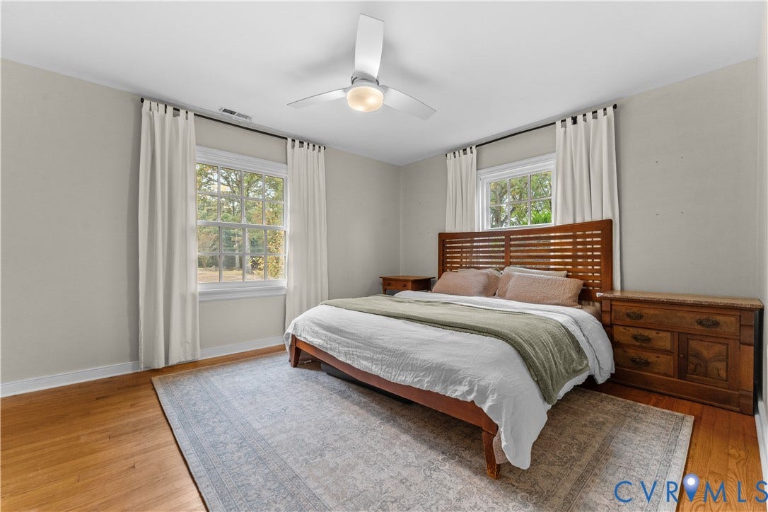 6956 Old Westham Road, Stratford Hills/Cherokee Road, Richmond, VA 23225 Wood-finish flooring, white multi-pane windows, and a ceiling-mounted light fixture with fan