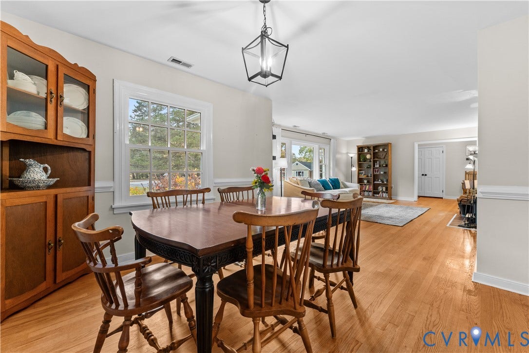 6956 Old Westham Road, Stratford Hills/Cherokee Road, Richmond, VA 23225 Dining area featuring wood-finish flooring, a geometric-frame lantern pendant light, and wainscoting