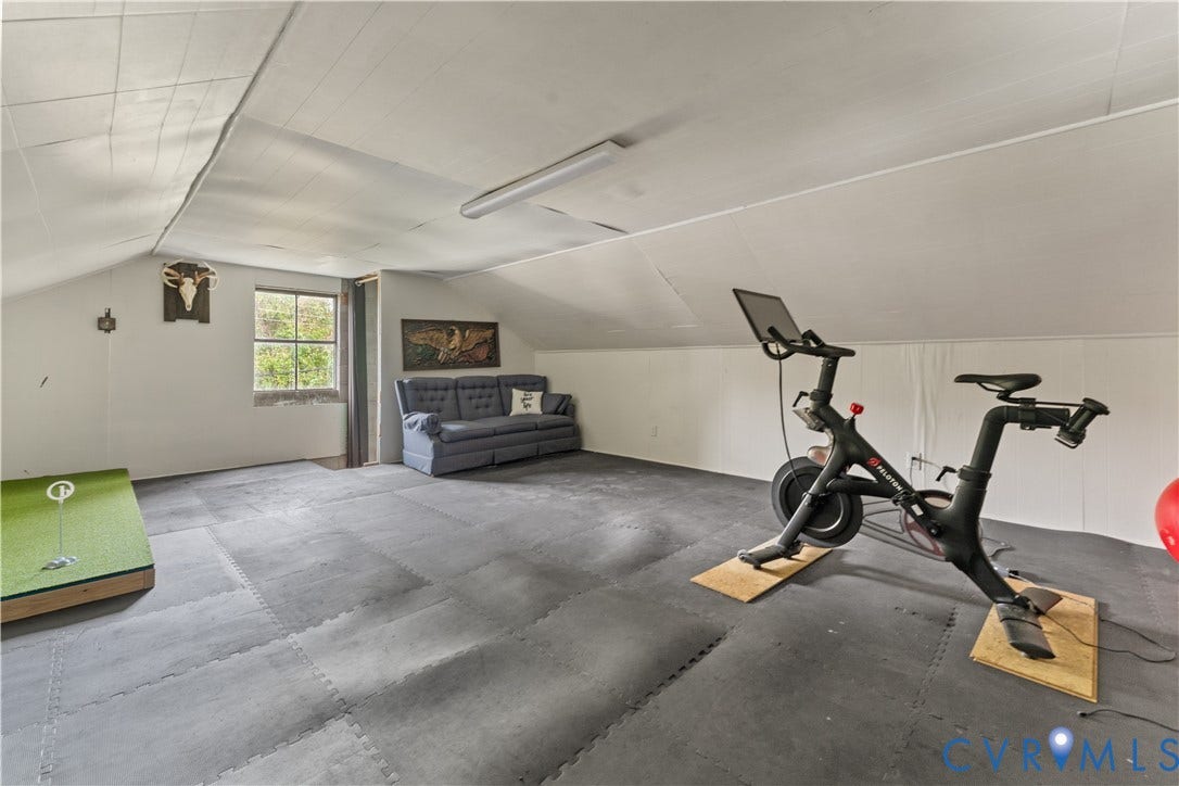 6956 Old Westham Road, Stratford Hills/Cherokee Road, Richmond, VA 23225 Finished attic space featuring vaulted ceilings, neutral wall finishes, and a window providing natural light
