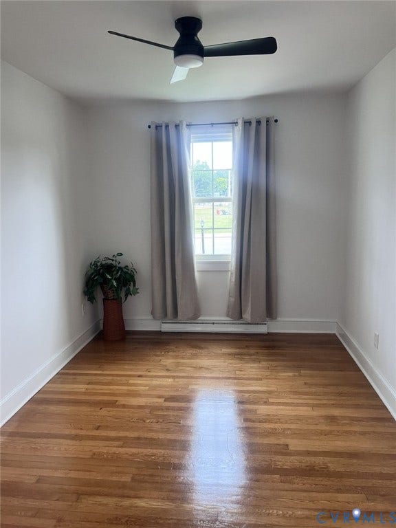 404 Ivey Avenue, Woodlawn, Colonial Heights, VA 23834 Hardwood flooring, single-hung window, and modern matte black ceiling fan
