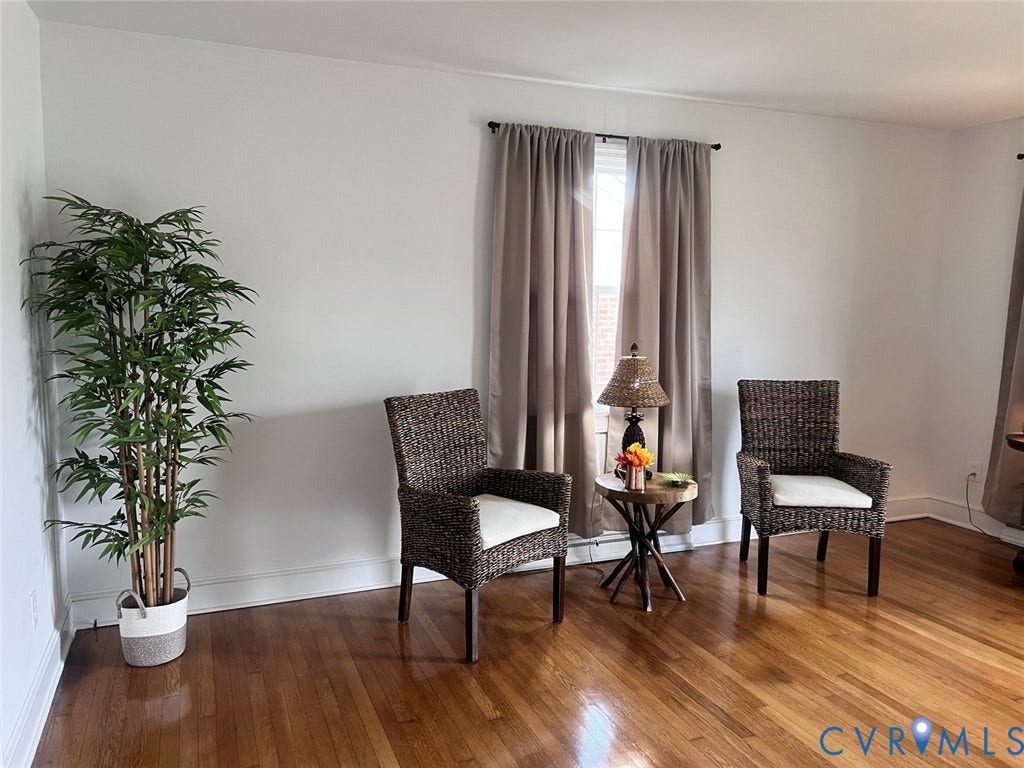 404 Ivey Avenue, Woodlawn, Colonial Heights, VA 23834 Bright room featuring wood-finish flooring and neutral-toned wall paint