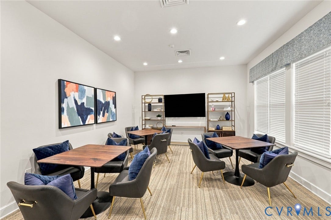 Interior space featuring recessed lighting, patterned carpeting, and horizontal window blinds