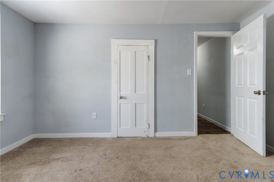 113 Spring Street, Pembroke, Petersburg, VA 23803 Neutral-toned wall paint, four-panel interior doors, and carpeting