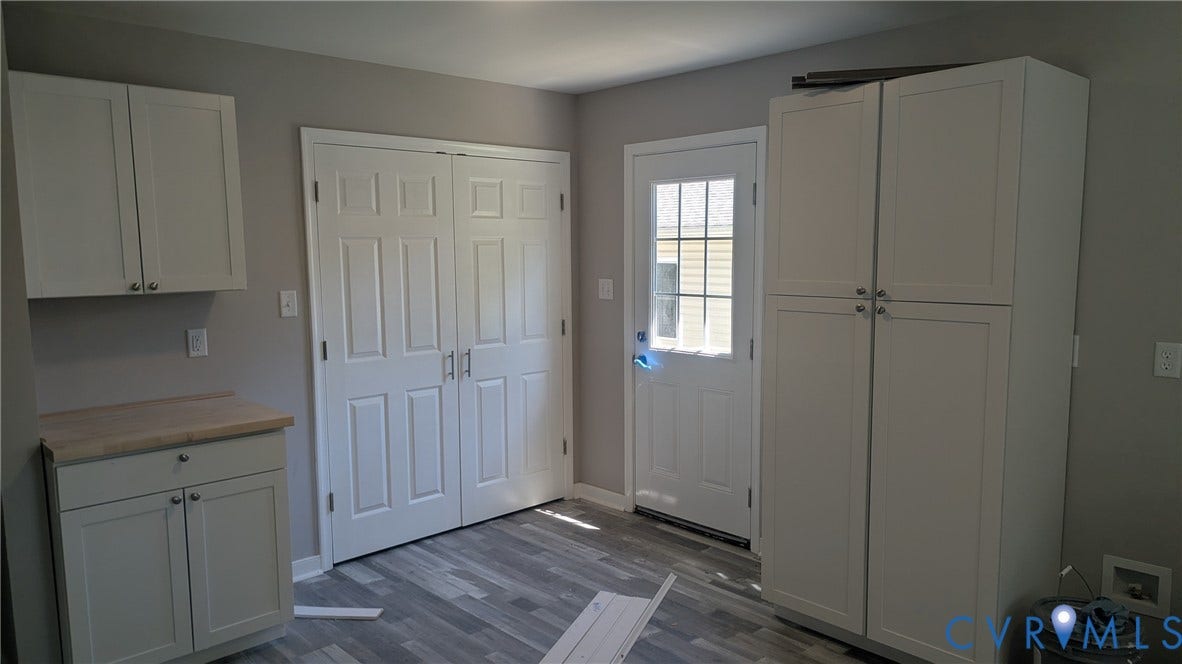 3006 Plumtree Street, South Chesterfield, VA 23834 Shaker-style cabinetry, wood-finish countertop, full-height storage pantry, wood-finish flooring, and a glass-paneled exterior door