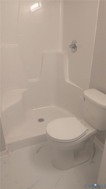 3006 Plumtree Street, South Chesterfield, VA 23834 Bathroom featuring a white molded acrylic shower surround with a built-in seat, chrome shower fixture, and a white porcelain toilet on tile flooring