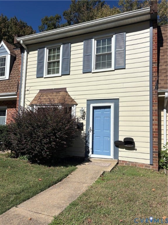 7946 Provincetown Drive, Chesterfield, VA 23235 Two-story exterior featuring horizontal siding, dark-trimmed shutters, a bay window with shingled roofing, and a concrete walkway