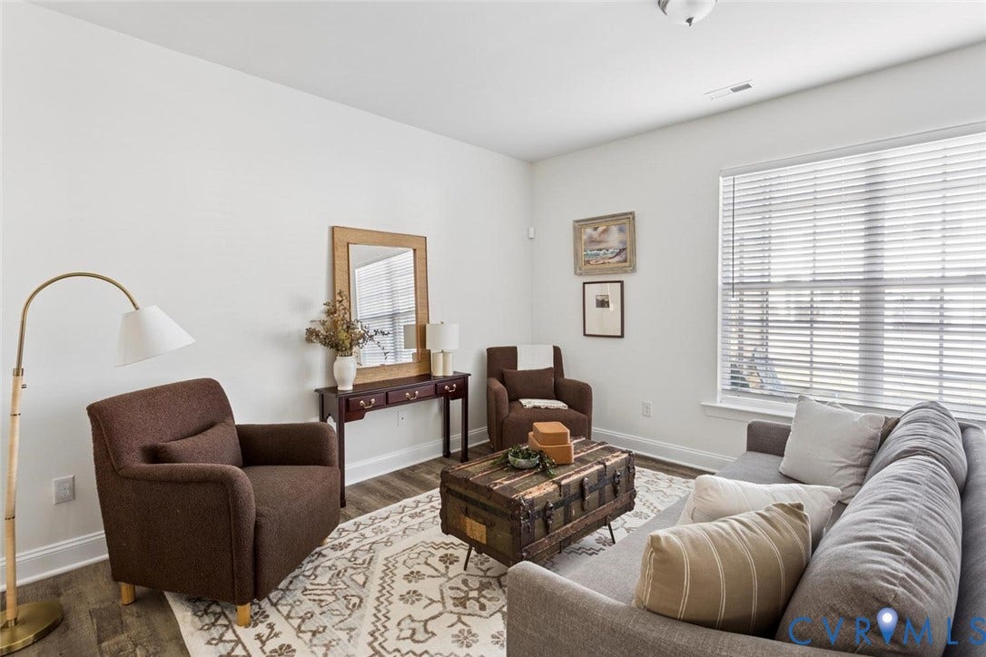 6177 Bowline Lane, Chesterfield, VA 23234 Recessed lighting, LVP flooring, white walls, and a large windows with blinds.