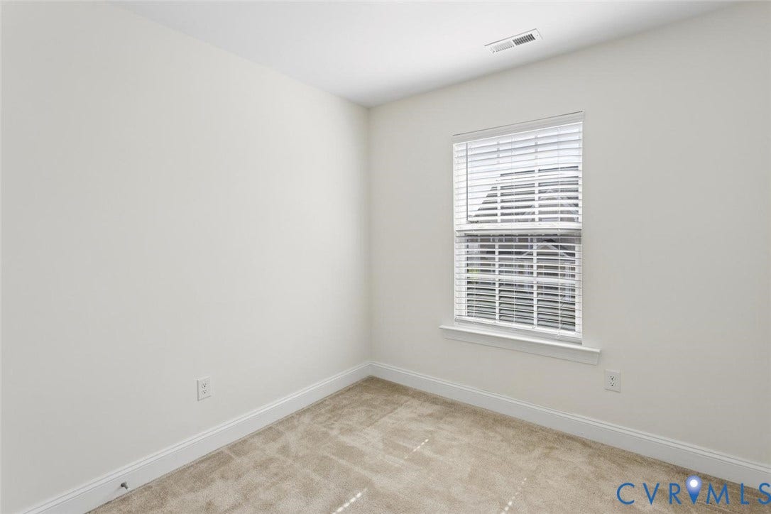 6177 Bowline Lane, Chesterfield, VA 23234 Neutral-toned carpeting, white painted walls, and a window with blinds.