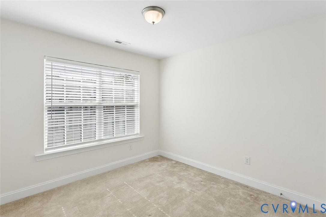6177 Bowline Lane, Chesterfield, VA 23234 Neutral wall finishes, window with blinds, carpet flooring, overhead flush-mount light fixture.