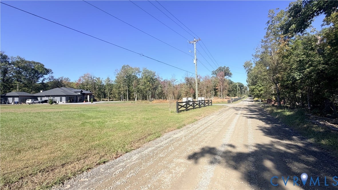 16106 Thoroughfare Road, Thoroughfare Rd, Broad Run, VA 20137 Expansive acreage featuring cleared level terrain, mature tree borders, and a dark-finish post-and-rail fence