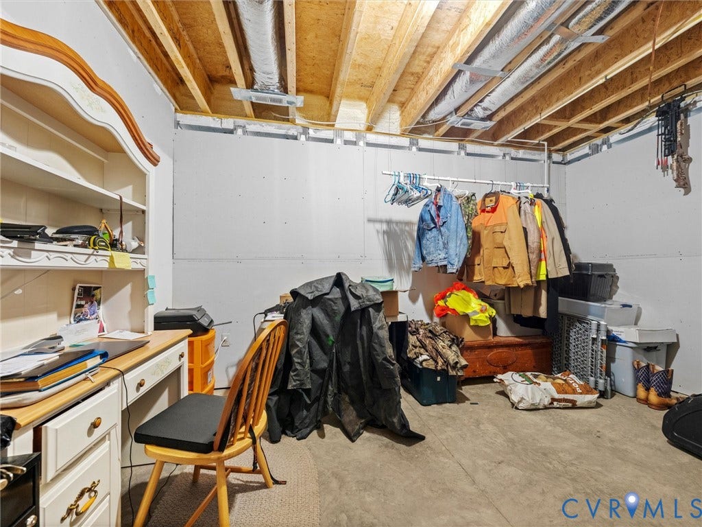 9877 Swinging Bridge Road, Taylors Grove Estates, Quinton, VA 23141 This partially finished room in the heated and cooled basement offers endless possibilities! An ideal space for a home gym, theater room, craft room, home office, or hobby space, ready to customize to suit your needs!