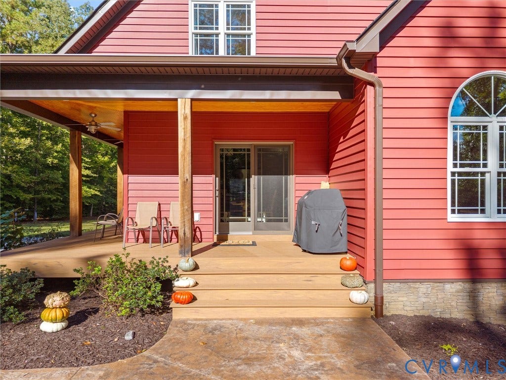 9877 Swinging Bridge Road, Taylors Grove Estates, Quinton, VA 23141 The inviting covered porch features low-maintenance composite decking, beautiful white oak posts, and sliding glass doors providing convenient access to the kitchen. A wonderful spot to relax, entertain, and enjoy the peaceful country setting!