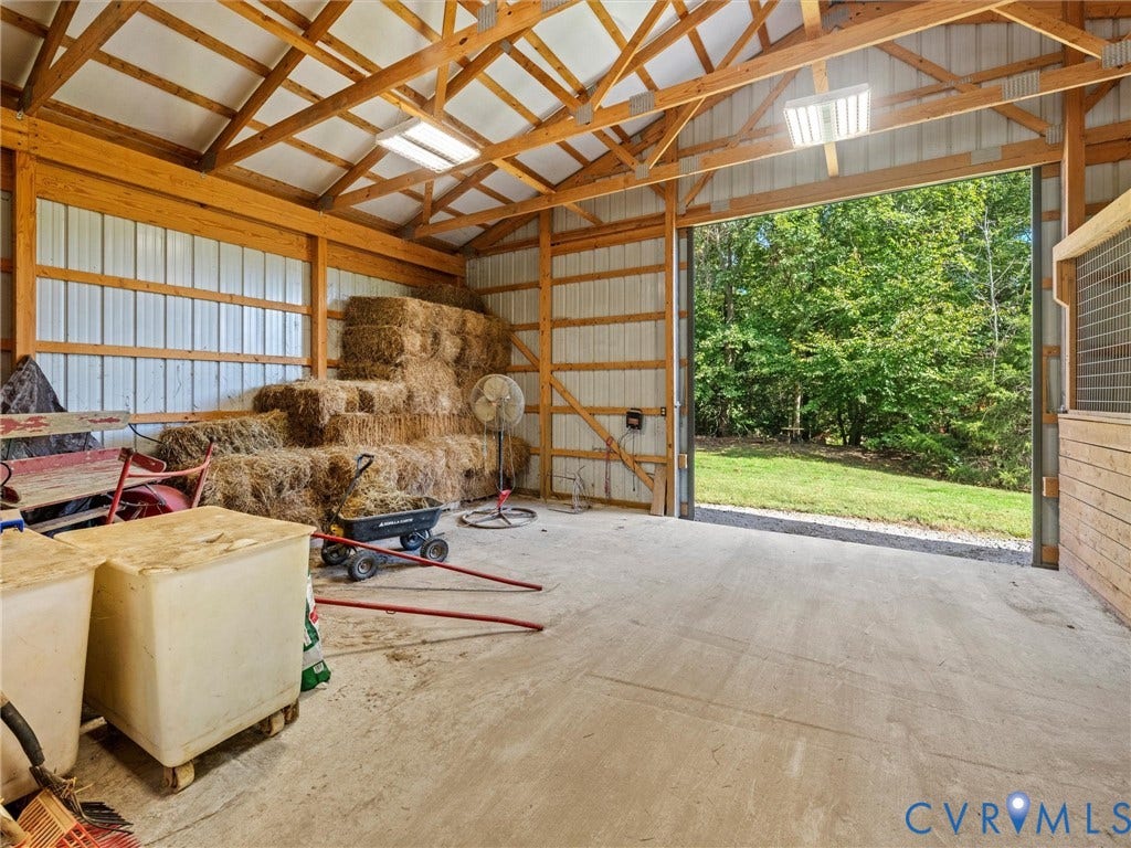 9877 Swinging Bridge Road, Taylors Grove Estates, Quinton, VA 23141 The spacious hay and storage area offers plenty of room for feed, hay, and equipment, with the potential to convert the space into two additional horse stalls. A versatile feature that allows the barn to grow with your equestrian needs!