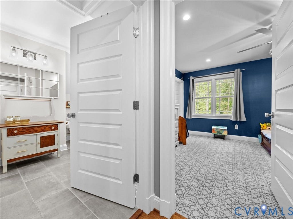 9877 Swinging Bridge Road, Taylors Grove Estates, Quinton, VA 23141 View from the upper-level hallway showcasing the spacious full hall bath, Bedroom 3, and a convenient hall linen closet. A thoughtfully designed layout offering comfort, functionality, and additional storage!