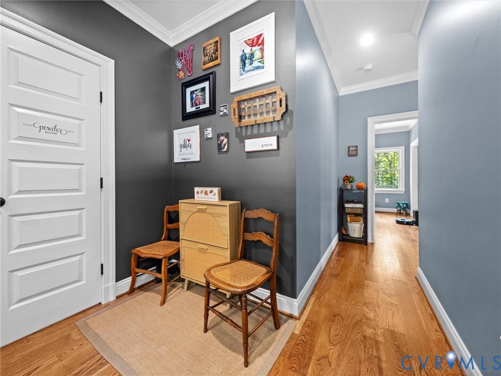 9877 Swinging Bridge Road, Taylors Grove Estates, Quinton, VA 23141 This versatile space just off the foyer features beautiful hardwood floors, stylish accent walls, and abundant natural light. A flexible area with endless possibilities to suit your needs!
