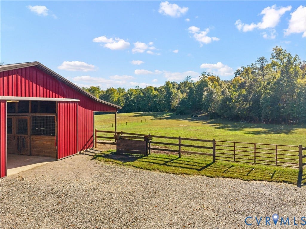 9877 Swinging Bridge Road, Taylors Grove Estates, Quinton, VA 23141 Beautiful fenced pastures with convenient access to the charming red horse barn provide an ideal setup for your equestrian lifestyle! Enjoy the ease of caring for your horses while taking in the scenic views of rolling green fields, mature trees, and the peaceful countryside surrounding The Little Red Homestead.