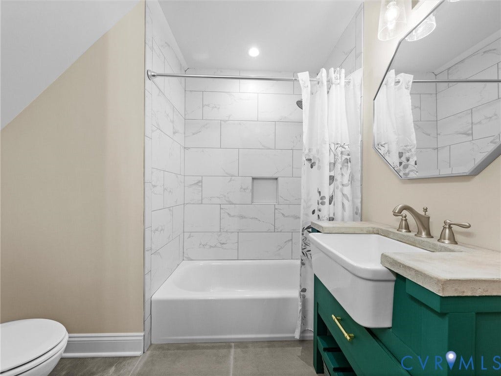 9877 Swinging Bridge Road, Taylors Grove Estates, Quinton, VA 23141 Another view of the spacious upper-level hall bath highlights the custom-made single-sink vanity, tile flooring, tub/shower combination with tile surround.