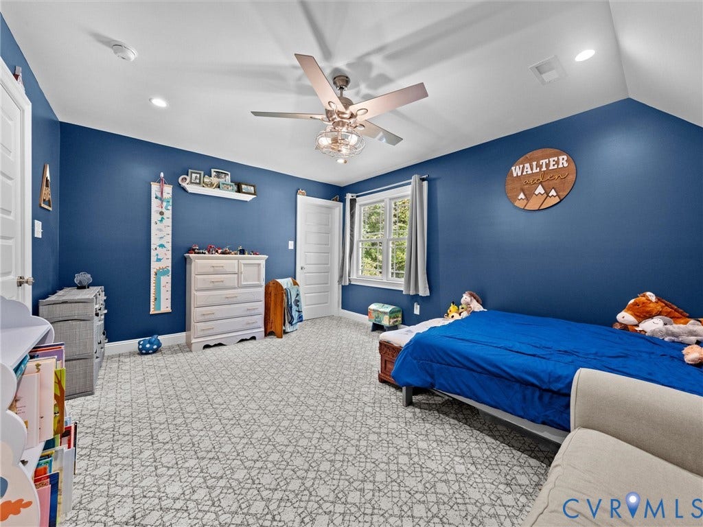 9877 Swinging Bridge Road, Taylors Grove Estates, Quinton, VA 23141 Another view of spacious second-level Bedroom 3 showcases the generous room size, two walk-in closets, plush carpeting, lighted ceiling fan, and two windows providing natural light. Plenty of space for comfortable living!