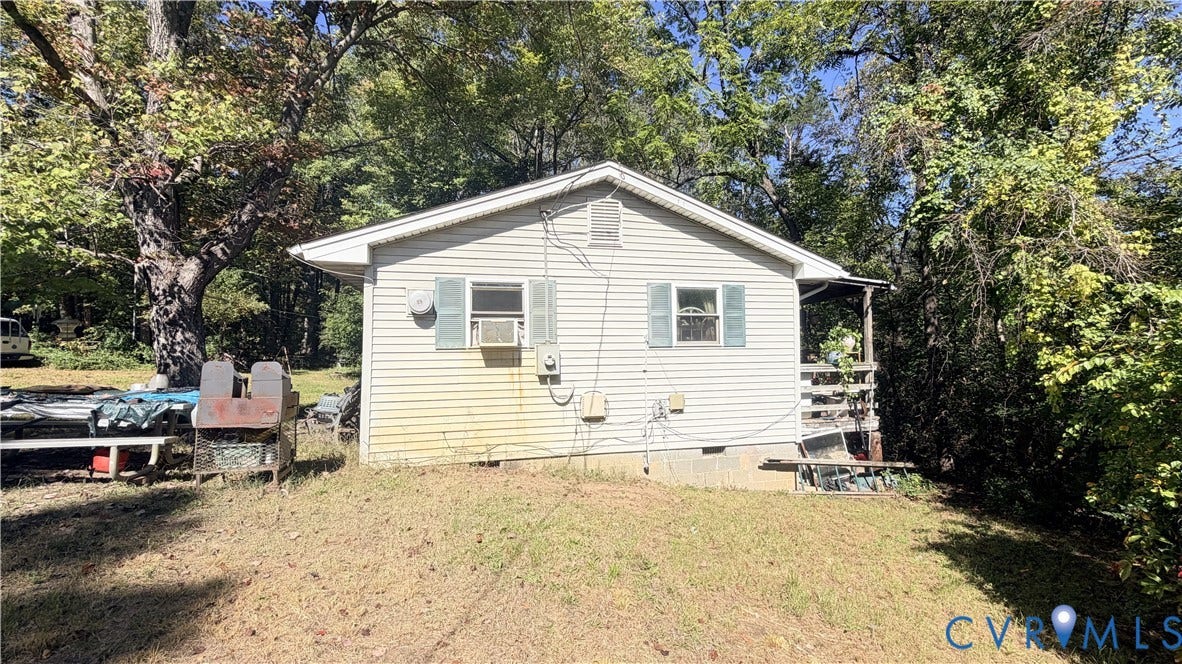 17019 Batestown Road, Batestown, Dumfries, VA 22025 Exterior featuring light-toned horizontal siding, gable roofline, decorative window shutters, and a partially covered side porch