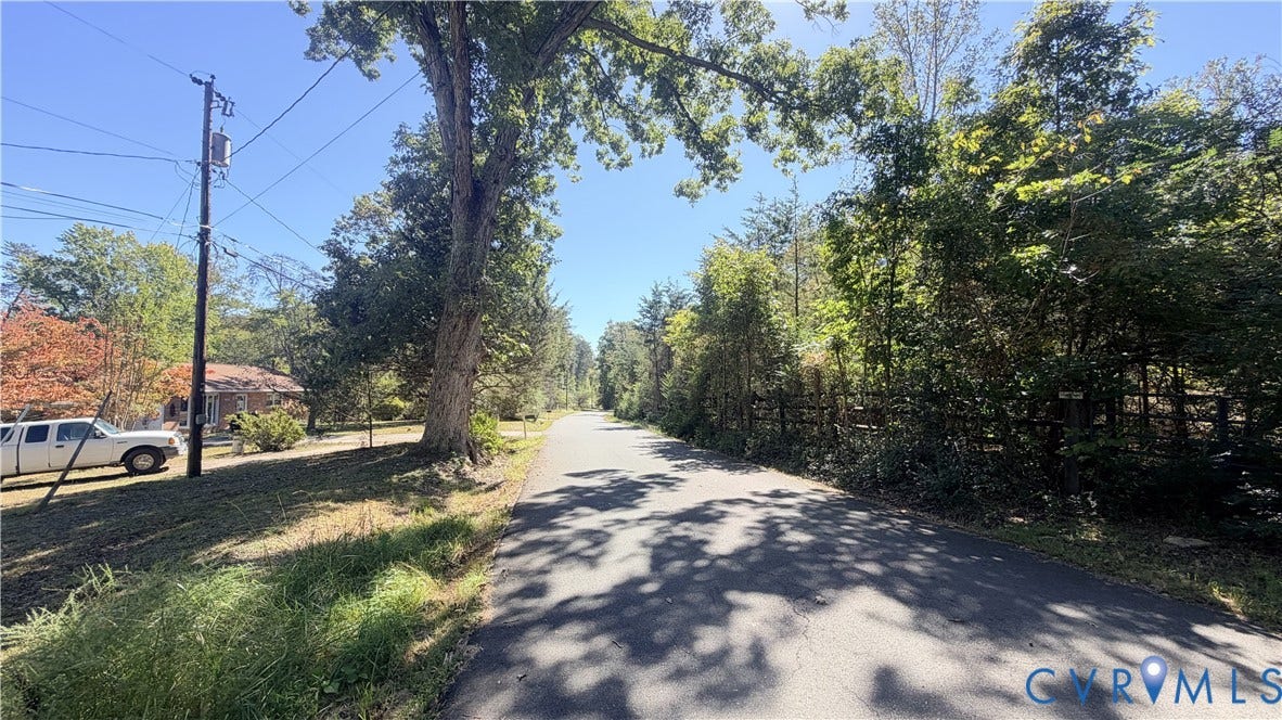 17019 Batestown Road, Batestown, Dumfries, VA 22025 Asphalt road frontage bordered by mature hardwood trees and native vegetation
