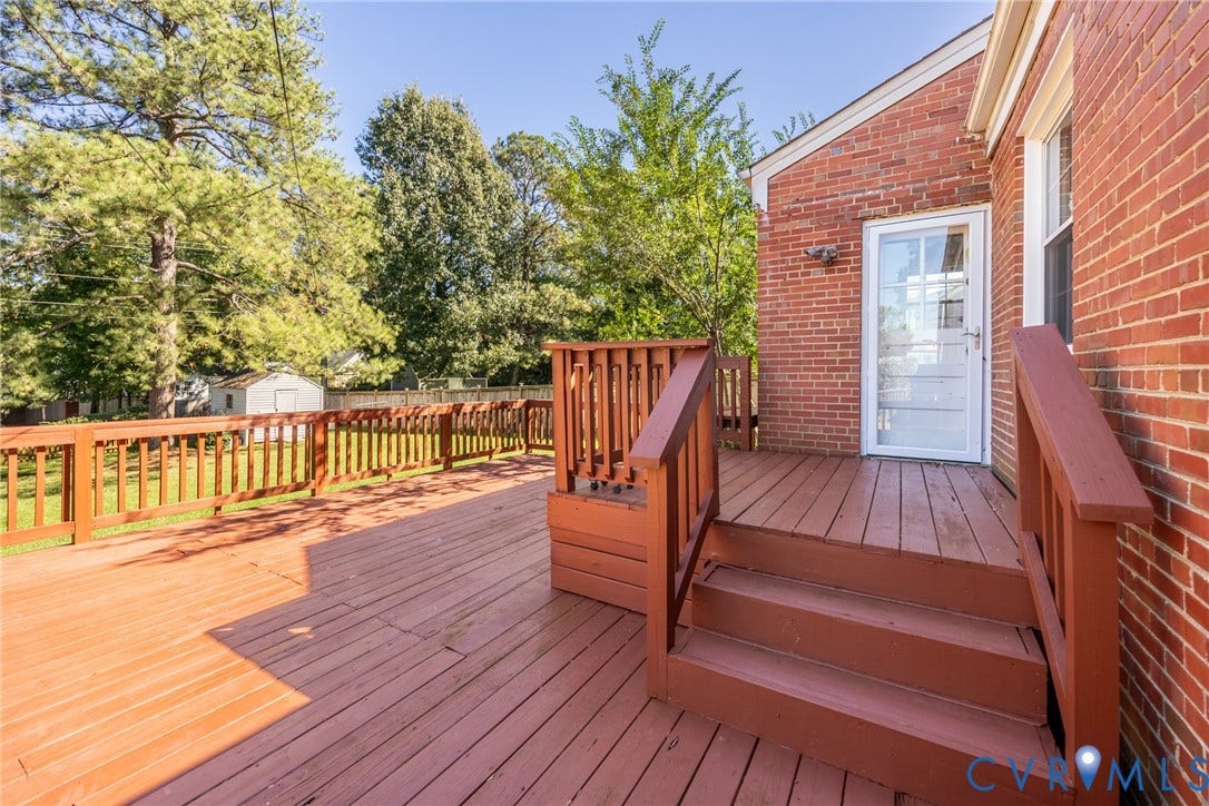6614 Monument Avenue, Westhaven, Henrico, VA 23226 Multi-level wood deck featuring stained railing, brick exterior, and full-glass storm door