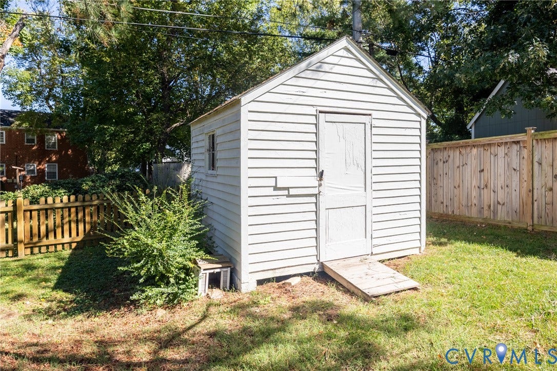 6614 Monument Avenue, Westhaven, Henrico, VA 23226 Storage structure with white horizontal siding, gabled roofline, single-panel entry door, and wooden ramp