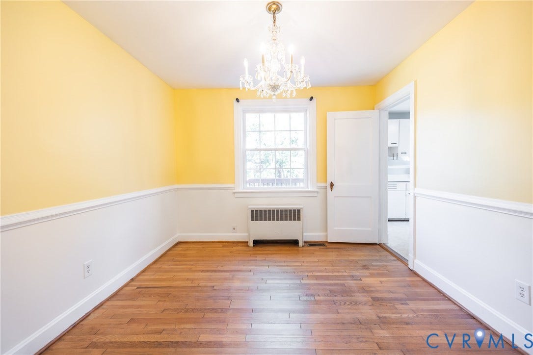 6614 Monument Avenue, Westhaven, Henrico, VA 23226 Room featuring wood-finish flooring, a multi-pane window, and a central crystal chandelier