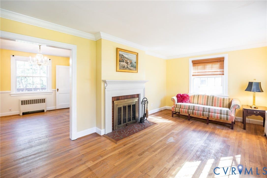 6614 Monument Avenue, Westhaven, Henrico, VA 23226 Living area featuring hardwood flooring, a fireplace with a decorative mantel, crown molding, and multi-pane windows