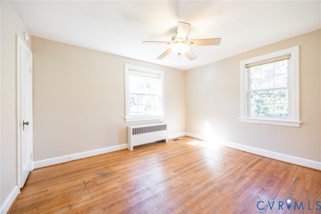 6614 Monument Avenue, Westhaven, Henrico, VA 23226 Room featuring wood-finish flooring, two multi-pane windows, and a central ceiling fan with integrated lighting