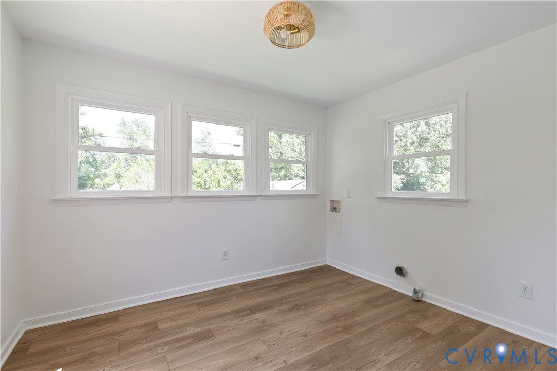 7263 Grace Lane, Mechanicsville, VA 23111 Room featuring wood-finish flooring, white walls, and white trim