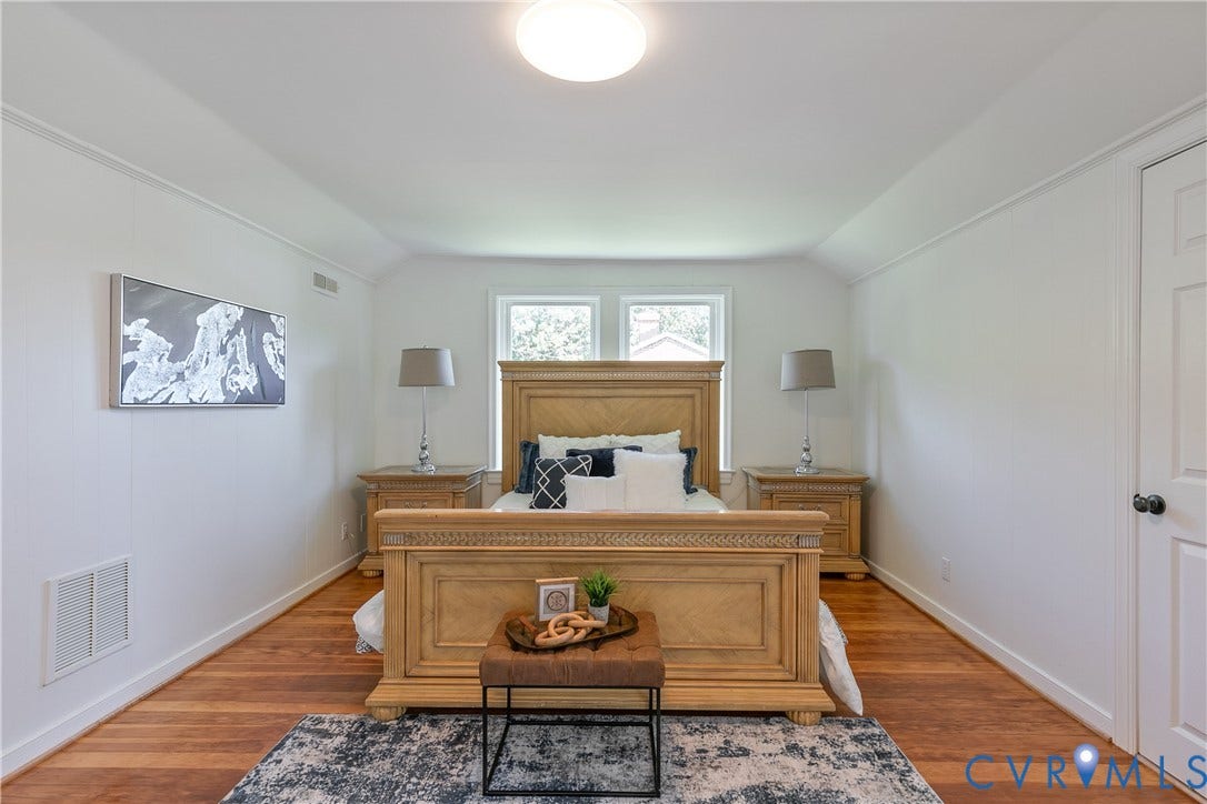 7263 Grace Lane, Mechanicsville, VA 23111 Spacious bedroom featuring wood-finish flooring, white walls, and a pair of windows