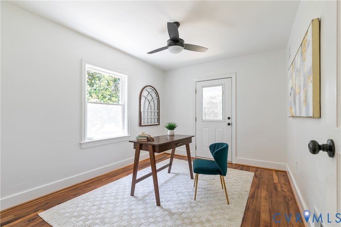 7263 Grace Lane, Mechanicsville, VA 23111 Bright room featuring wood-finish flooring, white walls, a ceiling fan with integrated lighting, and a window providing natural illumination