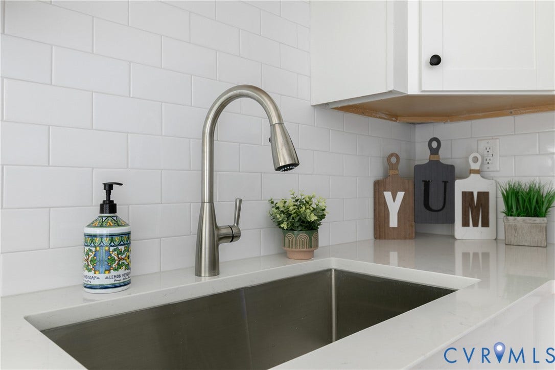 7263 Grace Lane, Mechanicsville, VA 23111 Stainless steel single-basin sink with a gooseneck pull-down faucet