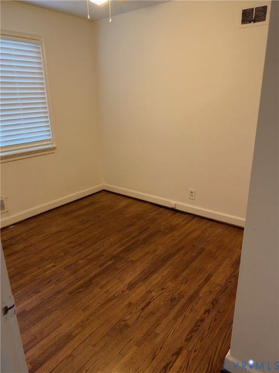 6523 Stuart Avenue, Richmond, VA 23226 Interior room featuring wood-finish flooring, neutral wall tones, and a window with horizontal blinds