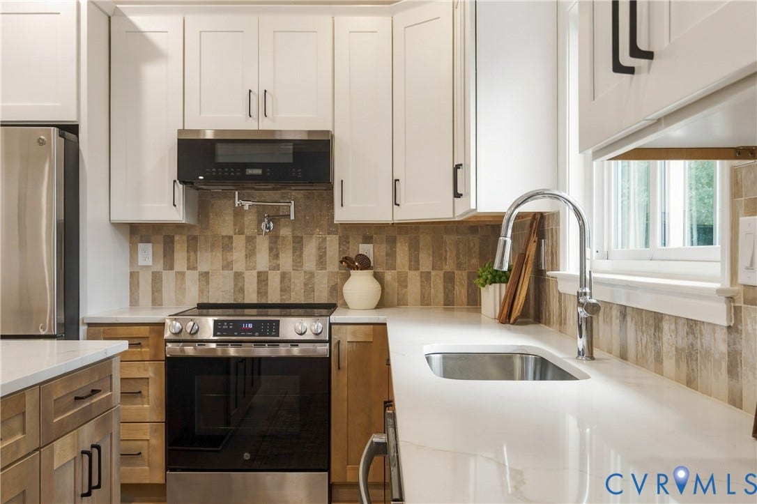 8060 Pebblepath Parkway, Hanover, VA 23111 Kitchen featuring shaker-style cabinetry, quartz countertops, tile backsplash, stainless steel appliances, and a wall-mounted pot filler