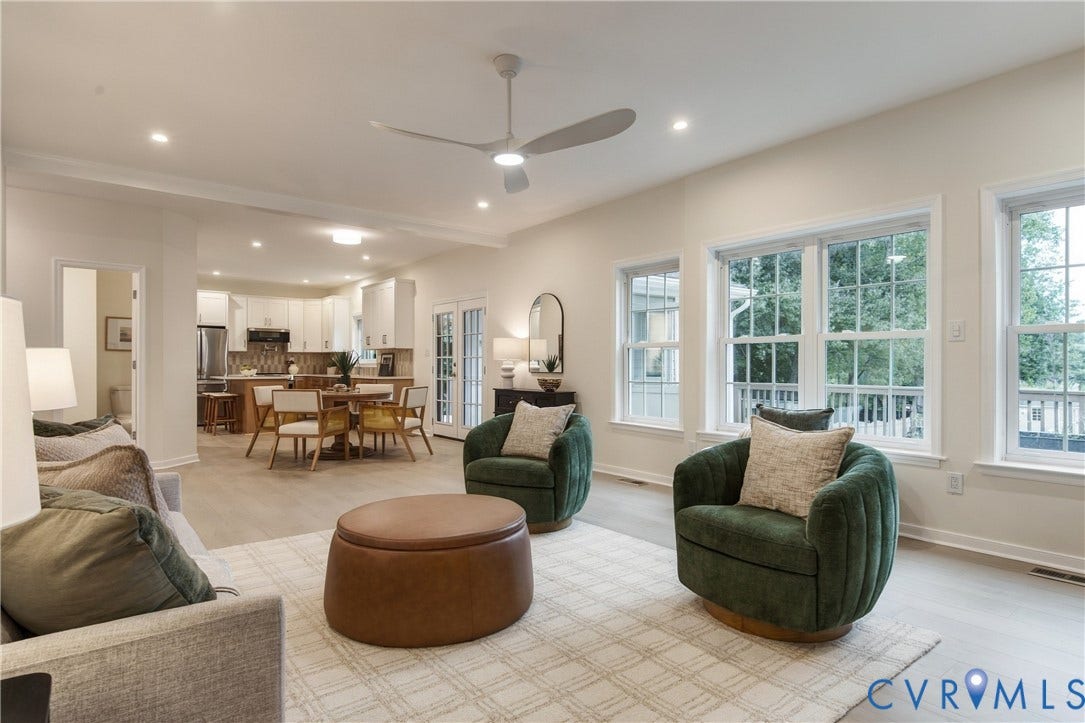 8060 Pebblepath Parkway, Hanover, VA 23111 Open-concept interior featuring light-toned wood-finish flooring, recessed lighting, a modern ceiling fan, and large windows with multi-pane configuration
