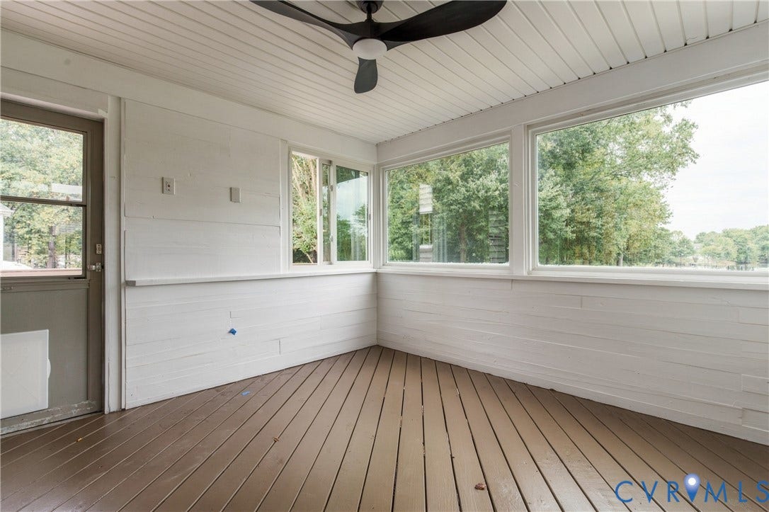8060 Pebblepath Parkway, Hanover, VA 23111 Enclosed porch featuring wood-finish flooring, white horizontal wall paneling, ceiling fan, and large windows