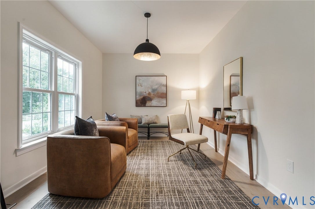 8060 Pebblepath Parkway, Hanover, VA 23111 Neutral-toned room featuring a multi-pane window, wood-finish flooring, and a large black dome pendant light fixture