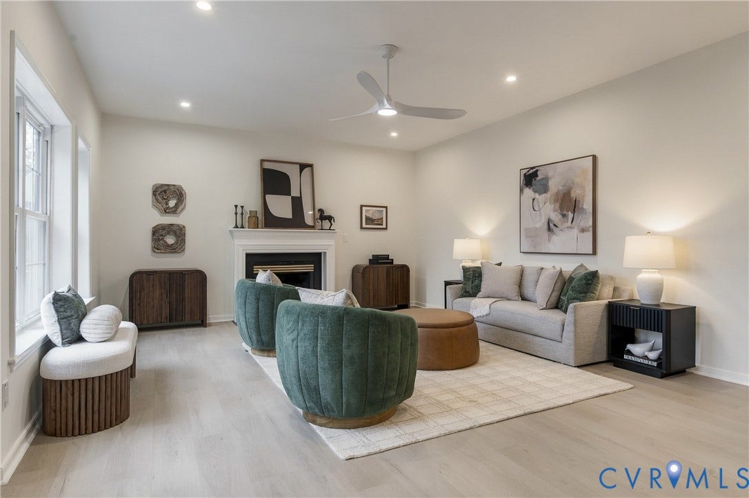 8060 Pebblepath Parkway, Hanover, VA 23111 Living area featuring light-toned wood-finish flooring, recessed lighting, a modern ceiling fan, and a fireplace with a decorative mantel