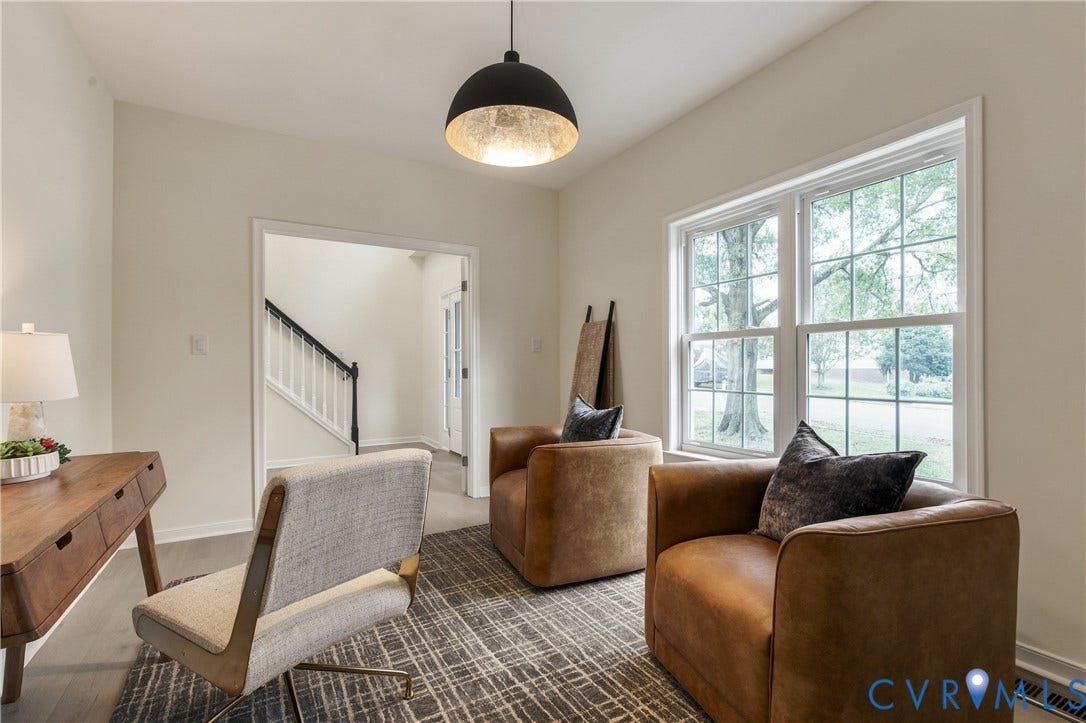 8060 Pebblepath Parkway, Hanover, VA 23111 Room featuring wood-finish flooring, dual-pane windows, and a black dome pendant light