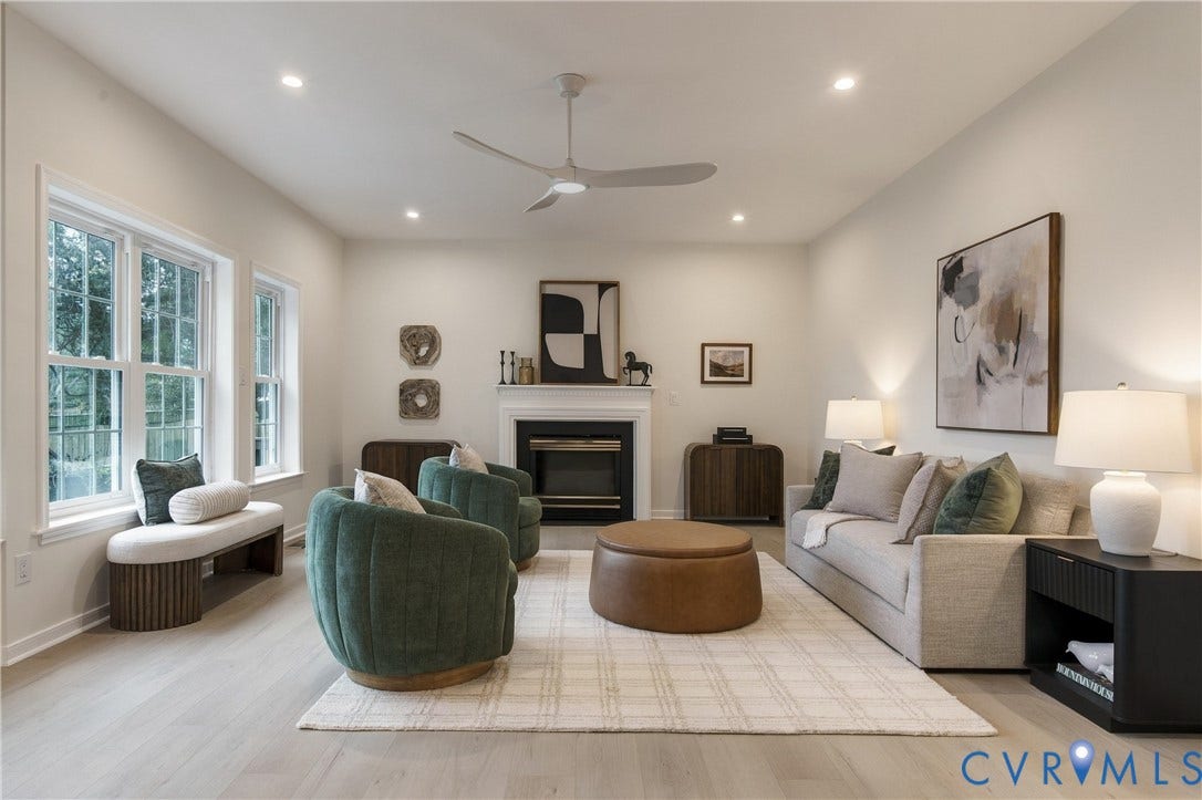 8060 Pebblepath Parkway, Hanover, VA 23111 Living area featuring wood-finish flooring, a fireplace with a white mantel, recessed lighting, a modern ceiling fan, and double-hung windows