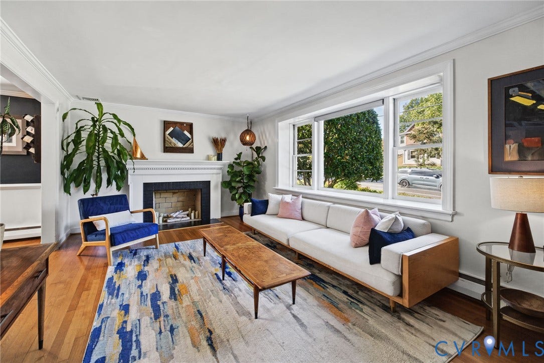 1009 Malvern Avenue, Malvern Gardens, Richmond, VA 23221 Living area featuring wood-finish flooring, a fireplace with a decorative mantel, and a large picture window
