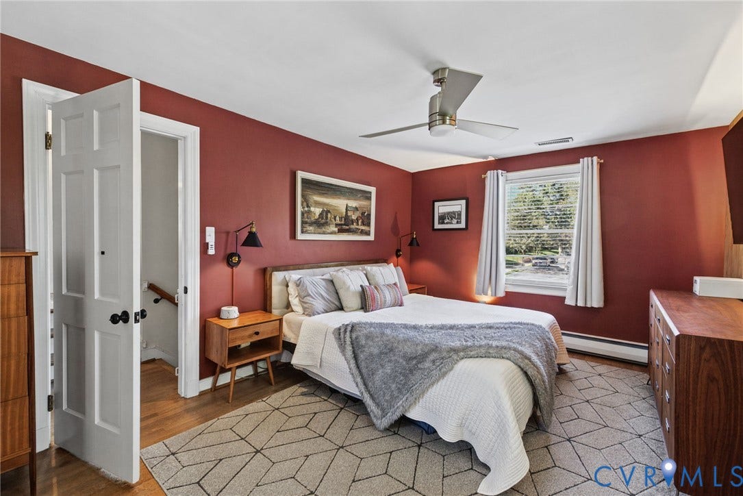1009 Malvern Avenue, Malvern Gardens, Richmond, VA 23221 Bedroom featuring wood-finish flooring, a multi-blade ceiling fan, and wall-mounted light fixtures