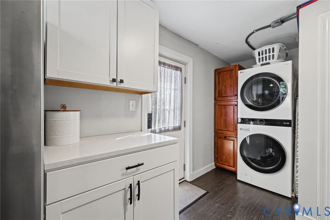 1009 Malvern Avenue, Malvern Gardens, Richmond, VA 23221 Laundry area featuring white shaker-style cabinetry, quartz countertops, a tall wood-finish storage cabinet, and wood-finish flooring