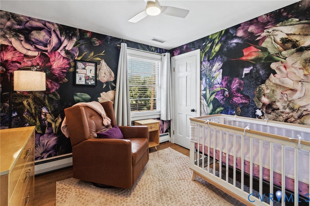 1009 Malvern Avenue, Malvern Gardens, Richmond, VA 23221 Room featuring floral-patterned wallpaper, wood-finish flooring, a multi-pane window, and a ceiling-mounted light fixture with integrated fan