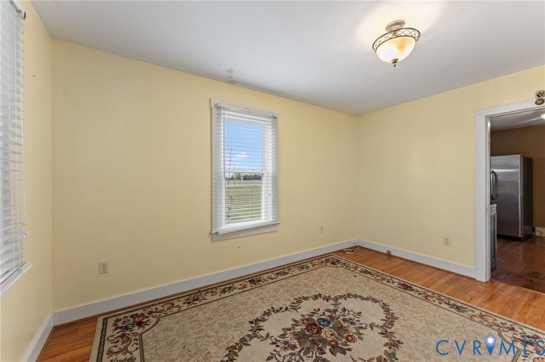 13530 Richmond Road, Village, Warsaw, VA 22572 Family Room with laminate floors.