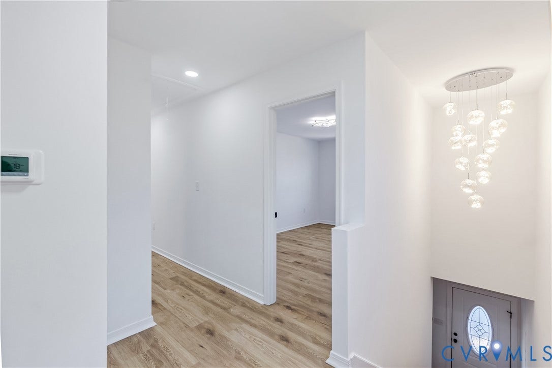 223 S Crater Road, Petersburg, VA 23803 Interior area featuring wood-finish flooring, recessed lighting, and a multi-pendant glass chandelier