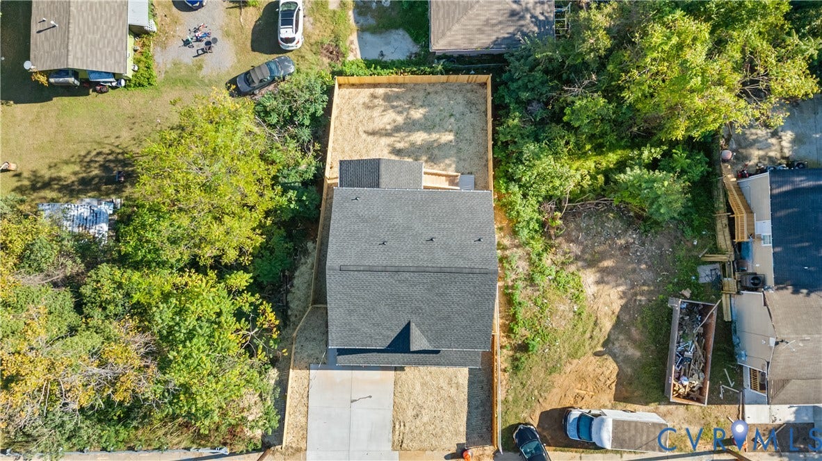 223 S Crater Road, Petersburg, VA 23803 Aerial perspective of the property featuring a concrete driveway, shingle-style roof, and fenced rear grounds