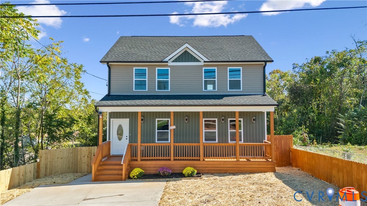 223 S Crater Road, Petersburg, VA 23803 Two-story residence featuring horizontal siding, a covered front porch with wooden railings, a dual-material exterior finish, and a shingled gable roof