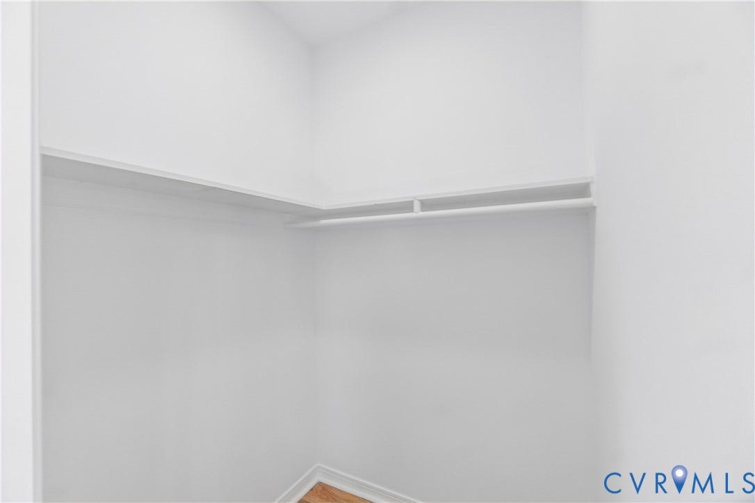 223 S Crater Road, Petersburg, VA 23803 Built-in shelving and integrated hanging rod with wood-finish flooring